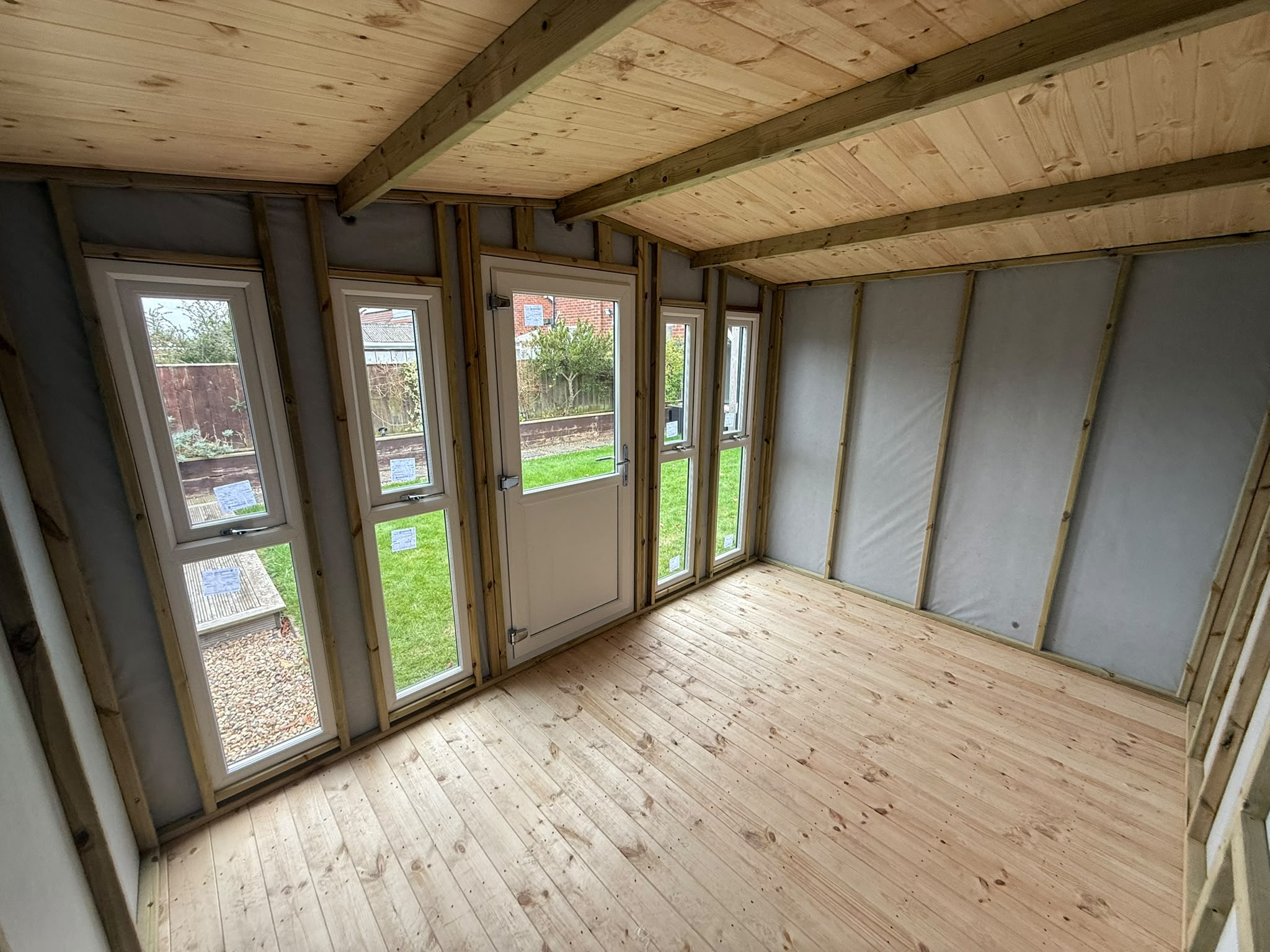 Interior view of a 12x8 log lap garden room fitted in Fairfield