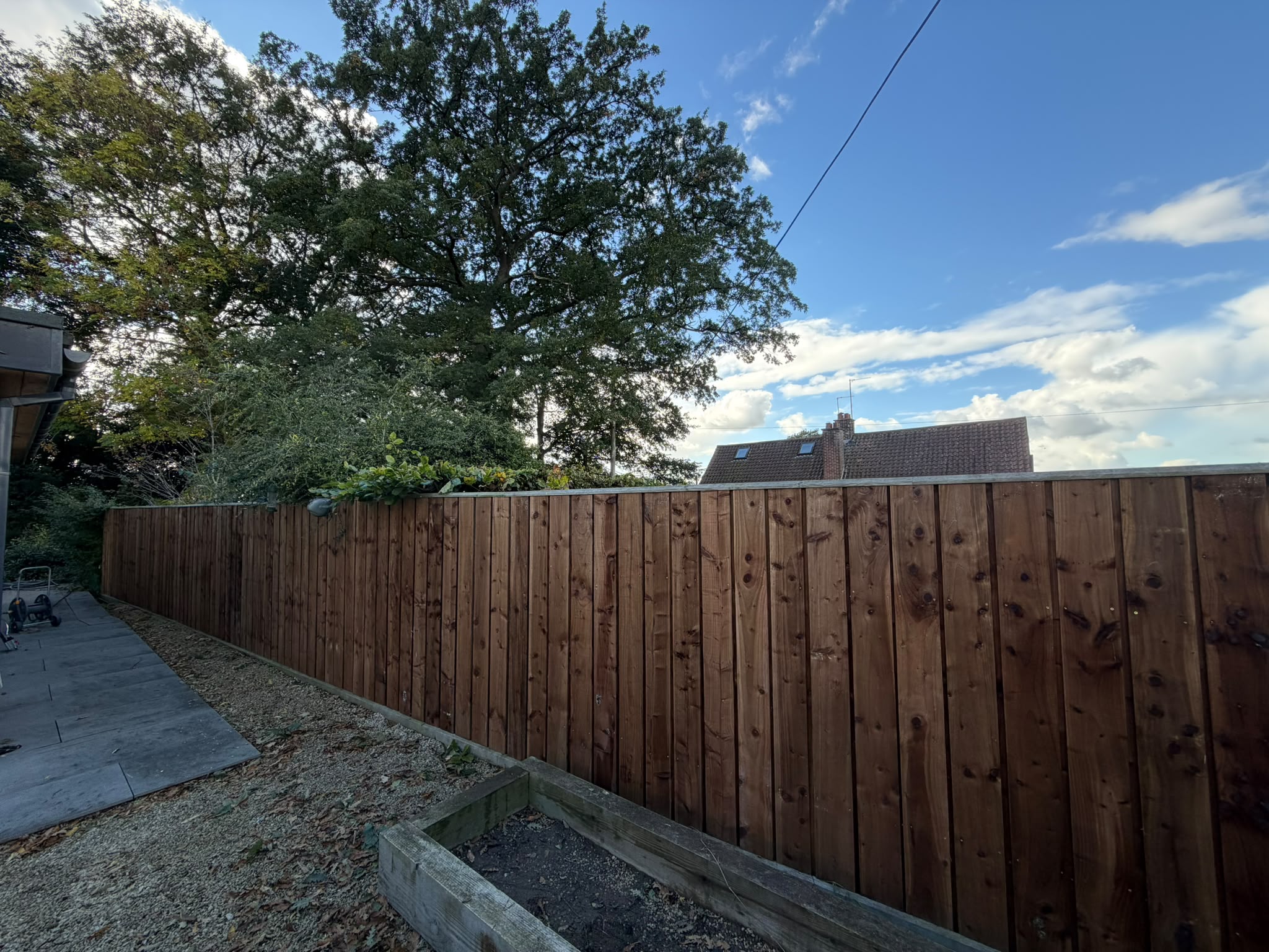 Solid timber acoustic fence viewed from inside a Great Smeaton garden